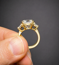Load image into Gallery viewer, Cushion Cut Center And Trapezid Shape Sides Diamond Engagement Ring IGI Certified 14k Solid Yellow Gold Three Stone Style Ring 6.00ctw G-VS2
