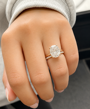 Load image into Gallery viewer, Oval Cut Simulated Diamonds And Round Cut Sides Engagement Ring And Matching Band Solitaire Wedding Set 5.30ctw Set In 14K Solid Yellow Gold
