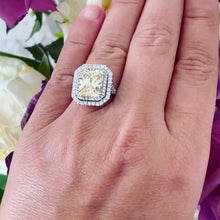 Load and play video in Gallery viewer, Large 6.00 Carats 14k Solid White Gold Radiant Cut Simulated Diamond and Light Fancy Yellow Diamonds Engagement Ring Double Halo
