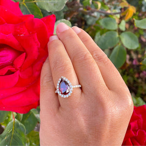 Garnet ring deals with diamond halo