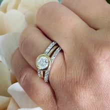 Load and play video in Gallery viewer, 14k Yellow And White Gold Round Cut Forever One Moissanite and Natural Diamond Engagement Ring And Two Bands Bezel Set Halo 2.40ctw
